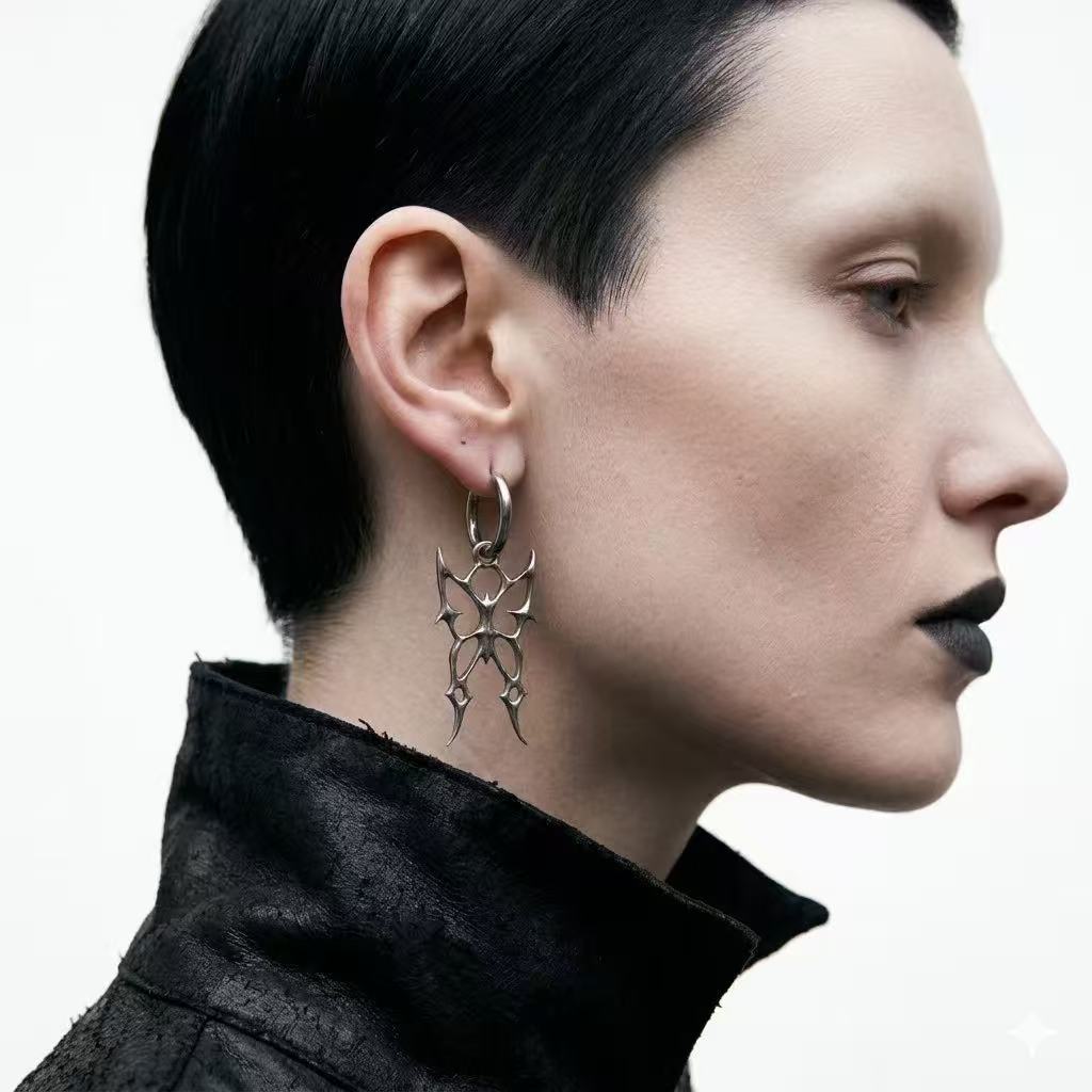 Earrings | polished-silver | Cybernicho | Molten Morpho Thorn Hoops | liquid-metal-butterfly-spike-design