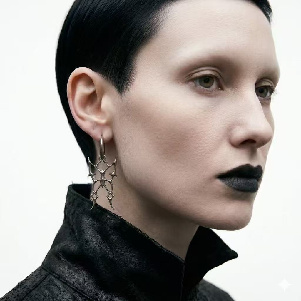 Earrings | polished-silver | Cybernicho | Molten Morpho Thorn Hoops | liquid-metal-butterfly-spike-design