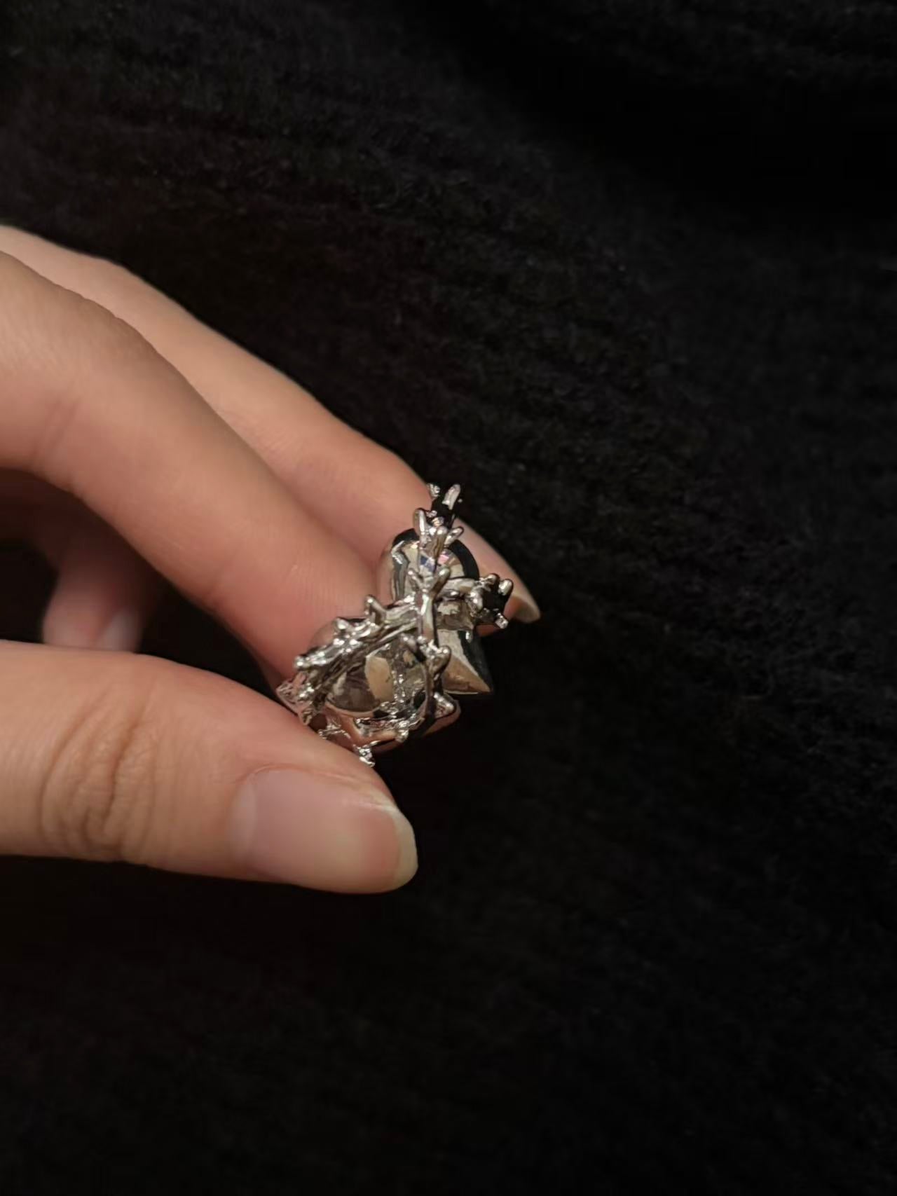 Rings | black-silver | Cybernicho | Molten Thorn Obsidian Heart Ring | sturdy-liquid-metal-thorn-jewelry